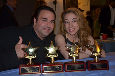 Sam Borowski (L) and actor Samantha Tuffarelli (R) display the 4 awards NIGHT CLUB won at the 28th Long Island Film Festival.