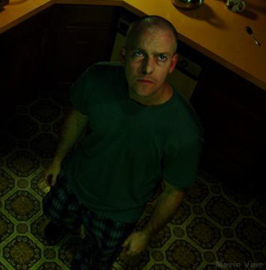 "Desperate to break out, he fights for survival, but we find that he's not in there alone in the cabin."